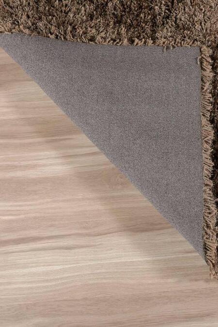 Shop Kaleen India Brown 100% Polyester Hand Tufted Solid Rectangle Rug at Aza Fashions Shop_Kaleen India_Brown 100% Polyester Hand Tufted Solid Rectangle Rug_at_Aza_Fashions