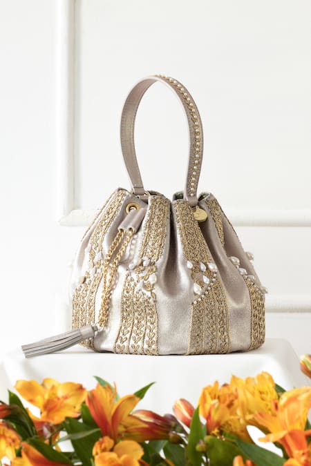 The Leather Garden Gold Embellished Naaz Cutdana Potli Bag at Aza Fashions The Leather Garden_Gold Embellished Naaz Cutdana Potli Bag _at_Aza_Fashions