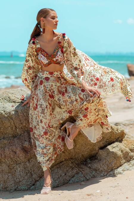 Pds By Sneha Ivory Crepe Embroidery, Sequins, Beads V-neck Paisley Print Cape Dhoti Pant Set at Aza Fashions Pds By Sneha_Ivory Crepe Embroidery, Sequins, Beads V-neck Paisley Print Cape Dhoti Pant Set _at_Aza_Fashions