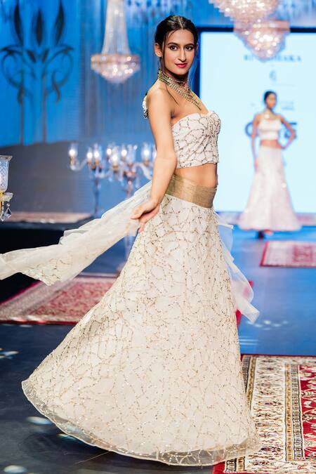 Rina Dhaka Pink Net Sequins Sweetheart Neck Meadow Off Shoulder Blouse Lehenga Set at Aza Fashions Rina Dhaka_Pink Net Sequins Sweetheart Neck Meadow Off Shoulder Blouse Lehenga Set _at_Aza_Fashions