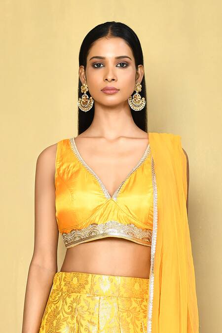 Shop Naintara Bajaj Yellow Brocade, Chiffon Sequins, Lace V-neck Embroidered Blouse Lehenga Set Online at Aza Fashions Shop_Naintara Bajaj_Yellow Brocade, Chiffon Sequins, Lace V-neck Embroidered Blouse Lehenga Set _Online_at_Aza_Fashions
