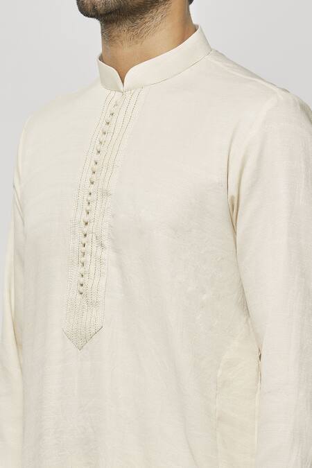 Shop Samyukta Singhania Cream Silk Embroidery Thread Work Placket Kurta Online at Aza Fashions Shop_Samyukta Singhania_Cream Silk Embroidery Thread Work Placket Kurta_Online_at_Aza_Fashions