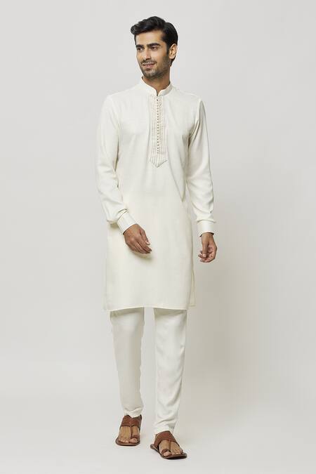 Buy Samyukta Singhania Cream Silk Embroidery Thread Placket Kurta Online at Aza Fashions Buy_Samyukta Singhania_Cream Silk Embroidery Thread Placket Kurta_Online_at_Aza_Fashions