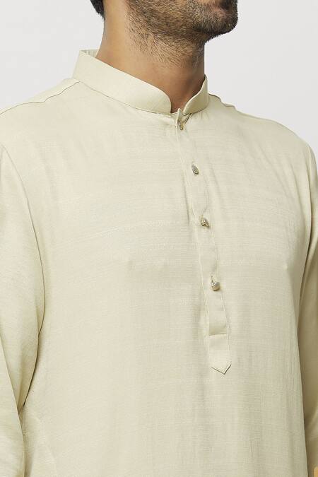 Shop Samyukta Singhania Beige Silk Pintucked Bordered Plain Kurta Online at Aza Fashions Shop_Samyukta Singhania_Beige Silk Pintucked Bordered Plain Kurta_Online_at_Aza_Fashions