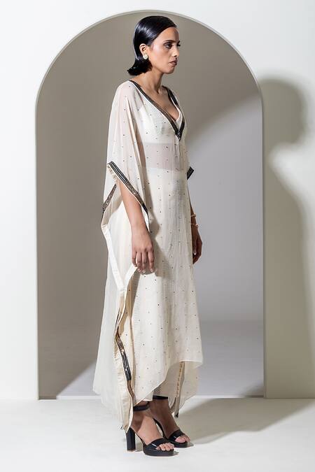 Kusmi Ivory Organza Sequins, Beads Plunge Neck And Embroidered Kaftan at Aza Fashions Kusmi_Ivory Organza Sequins, Beads Plunge Neck And Embroidered Kaftan _at_Aza_Fashions