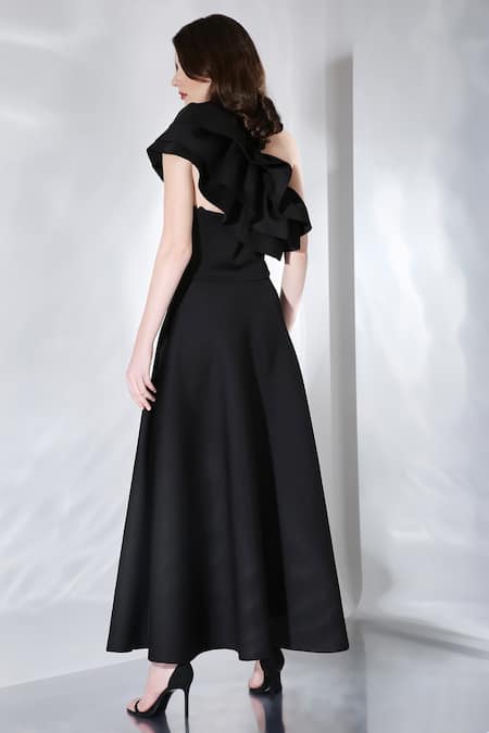 Shop Ozeqo Black Neoprene One Shoulder Gaia Dress And Ruffle Overlay Set at Aza Fashions Shop_Ozeqo_Black Neoprene One Shoulder Gaia Dress And Ruffle Overlay Set _at_Aza_Fashions