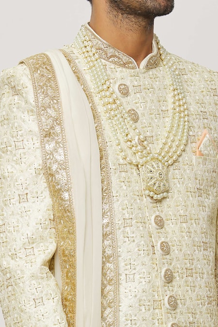 Shop Arihant Rai Sinha Cream Silk, Chanderi Crystals, Sequins Wave Embroidered Sherwani With Churidar Online at Aza Fashions Shop_Arihant Rai Sinha_Cream Silk, Chanderi Crystals, Sequins Wave Embroidered Sherwani With Churidar _Online_at_Aza_Fashions