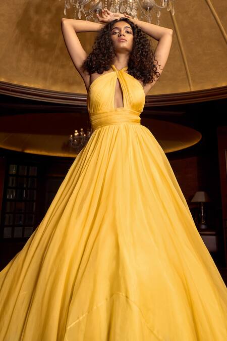 Astha Batra_Yellow Organza Cut Work Halter Neck Pleated Draped Flared Gown _Online_at_Aza_Fashions