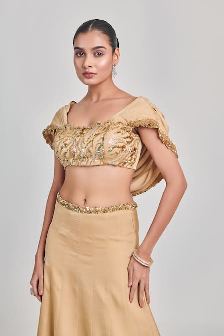 One Knot One By Ashna Beige Crepe, Satin Sequins, Cut Work Round Embroidered Draped Blouse With Skirt at Aza Fashions One Knot One By Ashna_Beige Crepe, Satin Sequins, Cut Work Round Embroidered Draped Blouse With Skirt _at_Aza_Fashions