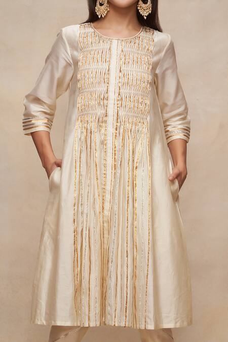 Shop Gulabo By Abu Sandeep Off White Chanderi Embellished Gota Work Round Neck A-line Kurta Online at Aza Fashions Shop_Gulabo By Abu Sandeep_Off White Chanderi Embellished Gota Work Round Neck A-line Kurta _Online_at_Aza_Fashions
