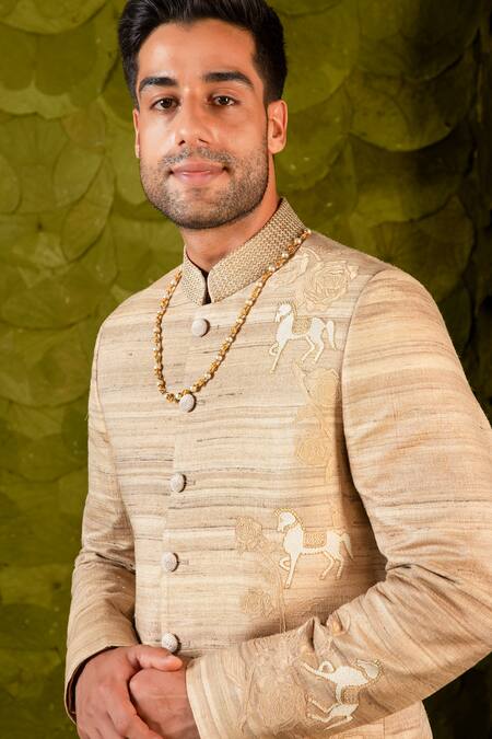 Buy Latha Puttanna Beige Staple Tussar Hand Embroidered Aari Gold Gandu Horse Bandhgala Online at Aza Fashions Buy_Latha Puttanna_Beige Staple Tussar Hand Embroidered Aari Gold Gandu Horse Bandhgala _Online_at_Aza_Fashions