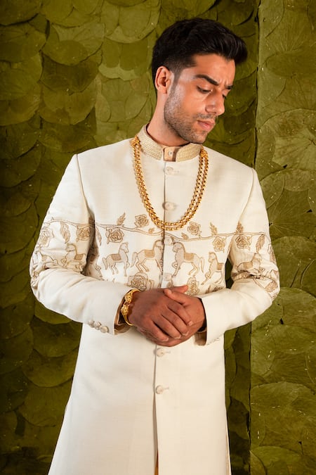 Latha Puttanna_Cream Matka Silk Hand Embroidered Aari Gold Beaten Gandu Horse Sherwani _Online_at_Aza_Fashions
