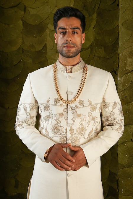Buy_Latha Puttanna_Cream Matka Silk Hand Embroidered Aari Gold Beaten Gandu Horse Sherwani _Online_at_Aza_Fashions