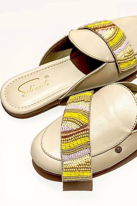 Shop Soleart Beige Bead Embellished Mules at Aza Fashions Shop_Soleart_Beige Bead Embellished Mules_at_Aza_Fashions