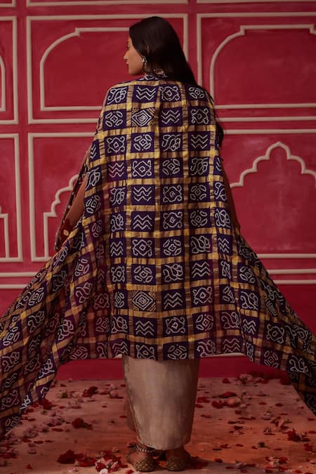 Shop Pink City By Sarika Purple Silk, Tissue Sequins Round Gharchola Bandhani Print Cape Draped Skirt Set at Aza Fashions Shop_Pink City By Sarika_Purple Silk, Tissue Sequins Round Gharchola Bandhani Print Cape Draped Skirt Set _at_Aza_Fashions