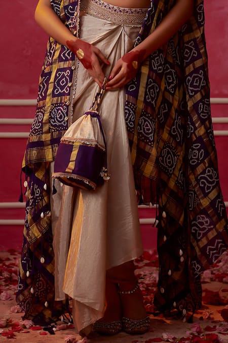 Pink City By Sarika Purple Silk, Tissue Sequins Round Gharchola Bandhani Print Cape Draped Skirt Set at Aza Fashions Pink City By Sarika_Purple Silk, Tissue Sequins Round Gharchola Bandhani Print Cape Draped Skirt Set _at_Aza_Fashions