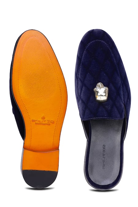 Shop Shutiq Blue Embellished Skull Velvet Mules at Aza Fashions Shop_Shutiq_Blue Embellished Skull Velvet Mules _at_Aza_Fashions