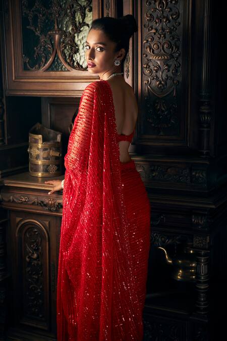 Shop Seema Gujral Red Net Sequins Sweetheart Neck Embroidered Saree With Blouse at Aza Fashions Shop_Seema Gujral_Red Net Sequins Sweetheart Neck Embroidered Saree With Blouse_at_Aza_Fashions
