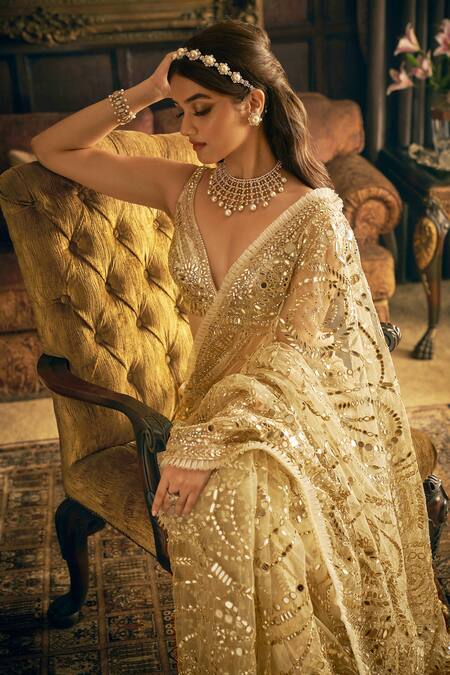 Seema Gujral_Cream Net Crystals, Mirrors, Sequins Plunge Neck Embroidered Saree With Blouse _at_Aza_Fashions