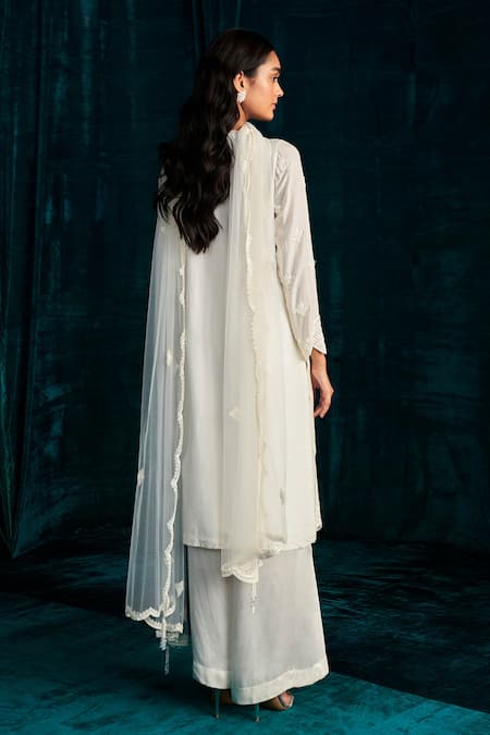 Shop Kashmiraa Ivory Georgette Embroidery, Cut Work, Sequins V-neck Dana Kurta Palazzo Set at Aza Fashions Shop_Kashmiraa_Ivory Georgette Embroidery, Cut Work, Sequins V-neck Dana Kurta Palazzo Set _at_Aza_Fashions