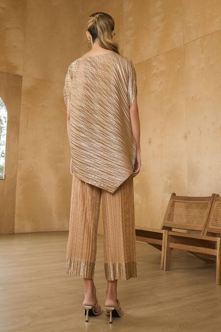 Shop Pleats By Aruni Gold Polyester Asymmetric Top With Pant at Aza Fashions Shop_Pleats By Aruni_Gold Polyester Asymmetric Top With Pant_at_Aza_Fashions