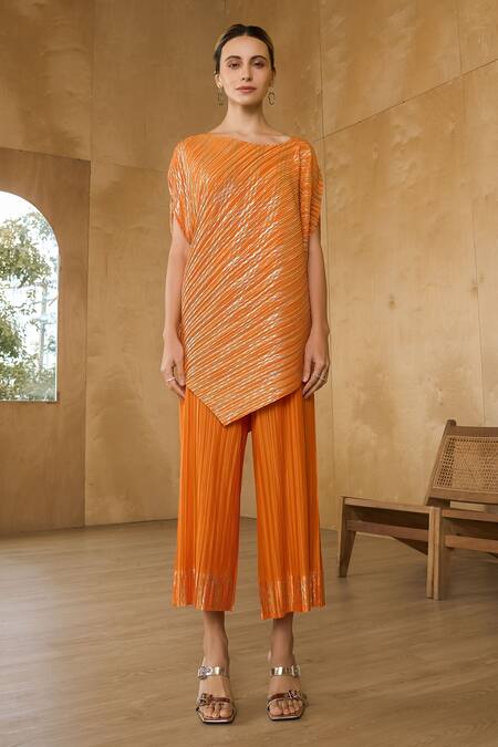 Shop Pleats By Aruni Orange Polyester Asymmetric Metallic Long Top With Pant at Aza Fashions Shop_Pleats By Aruni_Orange Polyester Asymmetric Metallic Long Top With Pant_at_Aza_Fashions