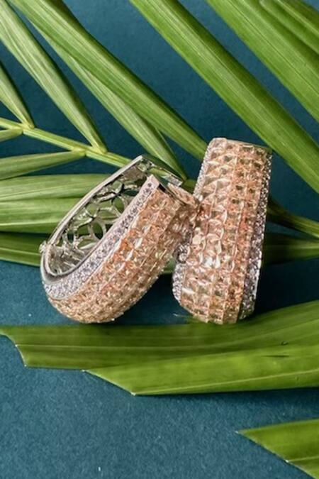 Nayaab By Sonia Gold Plated Stones Oro Anneau Twisted Earrings at Aza Fashions Nayaab By Sonia_Gold Plated Stones Oro Anneau Twisted Earrings _at_Aza_Fashions