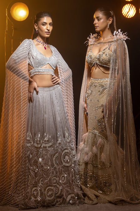 Kavita Arora Cream Net, Satin Crystals V-neck Hand Embroidered Cape Lehenga Set Online at Aza Fashions Kavita Arora_Cream Net, Satin Crystals V-neck Hand Embroidered Cape Lehenga Set _Online_at_Aza_Fashions