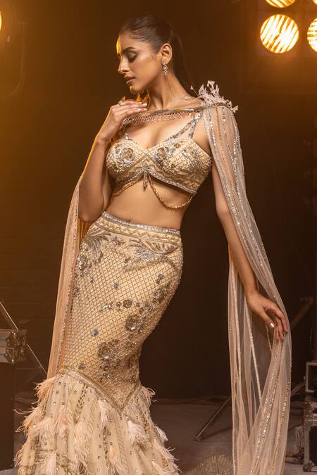 Shop Kavita Arora Cream Net, Satin Crystals V-neck Hand Embroidered Cape Lehenga Set Online at Aza Fashions Shop_Kavita Arora_Cream Net, Satin Crystals V-neck Hand Embroidered Cape Lehenga Set _Online_at_Aza_Fashions