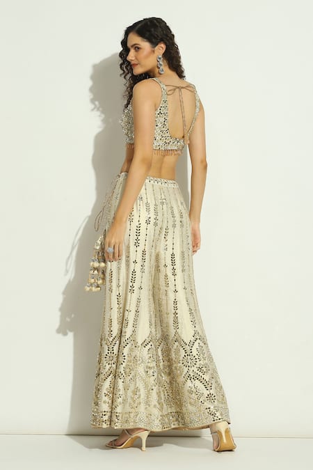 Vandana Sethi_Ivory Silk Crystals, Tassels, Zari V-neck Embroidered Blouse Sharara Set _Online_at_Aza_Fashions