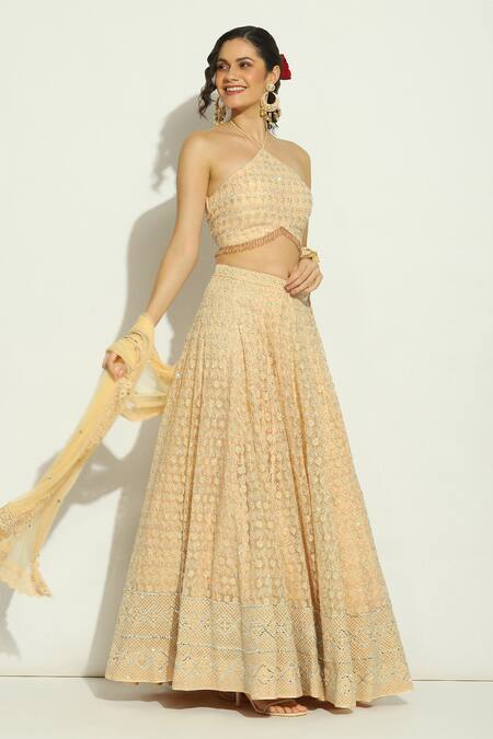 Buy_Vandana Sethi_Peach Net Embroidery, Stones Halter Neck Floral Lehenga Set _Online_at_Aza_Fashions