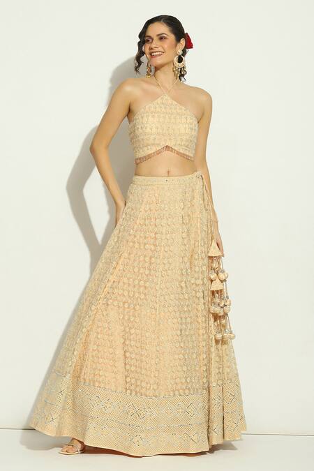 Vandana Sethi_Peach Net Embroidery, Stones Halter Neck Floral Lehenga Set _at_Aza_Fashions
