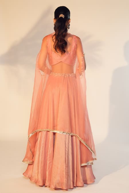 Shop Anu Pellakuru Peach Satin, Organza Cut Work, Pearls Hand Embroidered Blouse Lehenga Set at Aza Fashions Shop_Anu Pellakuru_Peach Satin, Organza Cut Work, Pearls Hand Embroidered Blouse Lehenga Set _at_Aza_Fashions