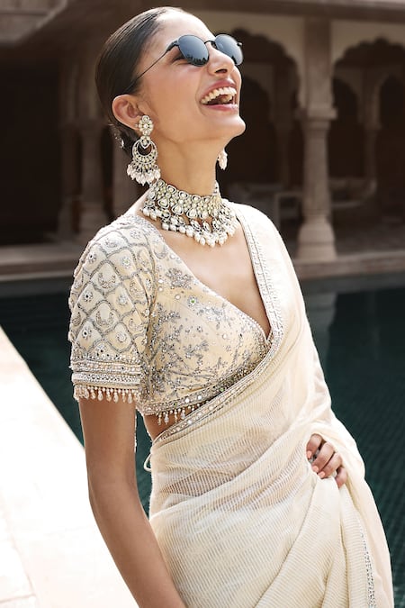 Matsya Ivory Tissue Tassels, Tarnished Royal Zardozi Embroidered Blouse And Saree Set Online at Aza Fashions Matsya_Ivory Tissue Tassels, Tarnished Royal Zardozi Embroidered Blouse And Saree Set _Online_at_Aza_Fashions