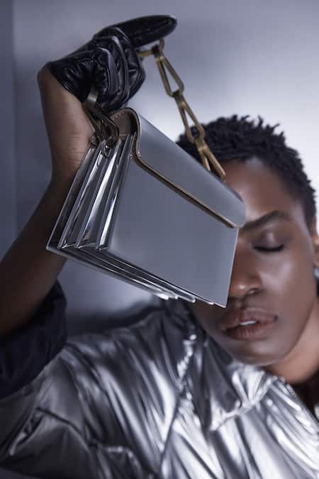 Tann-ED_Silver Plain Metallic Plate Clutch _at_Aza_Fashions