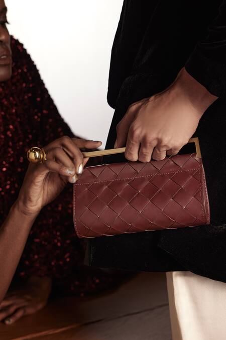 Buy Tann-ED Red Textured Woven Fold Over Clutch Online at Aza Fashions Buy_Tann-ED_Red Textured Woven Fold Over Clutch _Online_at_Aza_Fashions