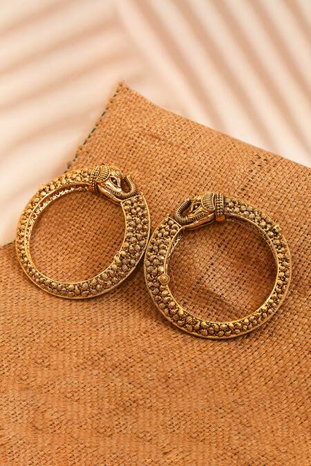 Shop_Anjali Jain_Gold Plated Cut Work Elephant Carved Bangles - Set Of 2_at_Aza_Fashions