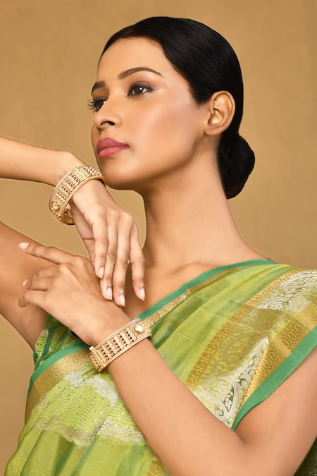 Anjali Jain_Gold Plated Stones Geometric Carved Bangles - Set Of 2_Online_at_Aza_Fashions