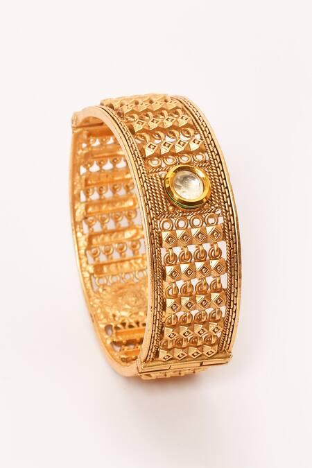 Anjali Jain_Gold Plated Stones Geometric Carved Bangles - Set Of 2_at_Aza_Fashions