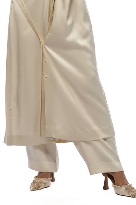 Buy AK-OK Cream Silk Collared Asymmetric Buttoned Panel Long Shirt Jacket With Trouser Online at Aza Fashions Buy_AK-OK_Cream Silk Collared Asymmetric Buttoned Panel Long Shirt Jacket With Trouser _Online_at_Aza_Fashions