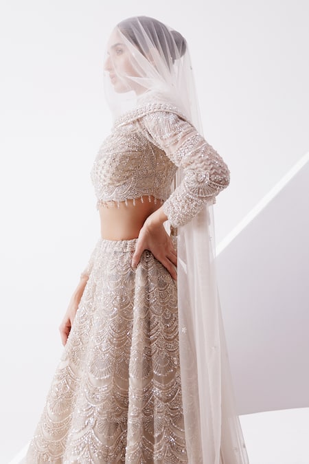 Shop_Istya_Beige Net Sequins, Cut Work Plunge Neck Scallop Embroidered Bridal Lehenga Set _at_Aza_Fashions