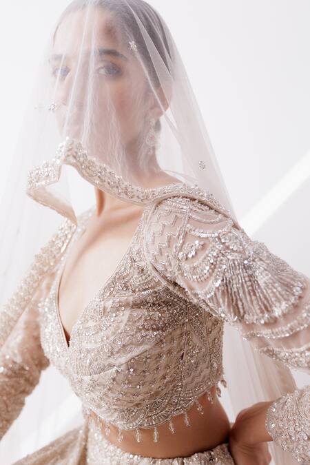 Shop_Istya_Beige Net Sequins, Cut Work Plunge Neck Scallop Embroidered Bridal Lehenga Set _Online_at_Aza_Fashions