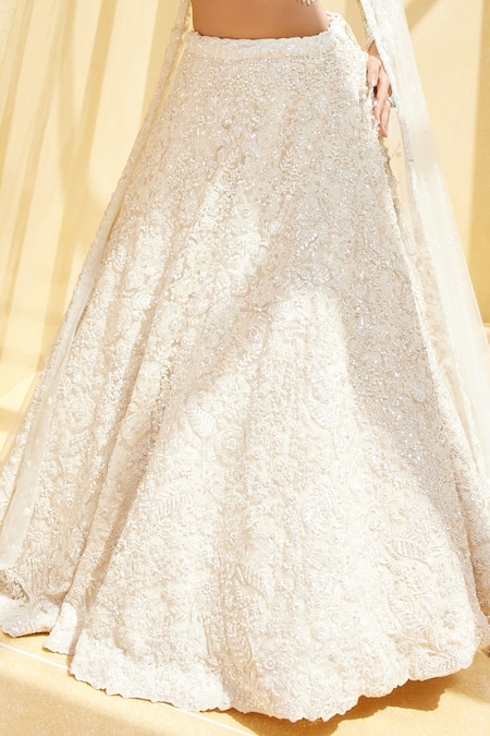 Shop Istya Ivory Net Sequins, Beads, Cut Work Rosette Bloom Embellished Bridal Lehenga Set Online at Aza Fashions Shop_Istya_Ivory Net Sequins, Beads, Cut Work Rosette Bloom Embellished Bridal Lehenga Set _Online_at_Aza_Fashions
