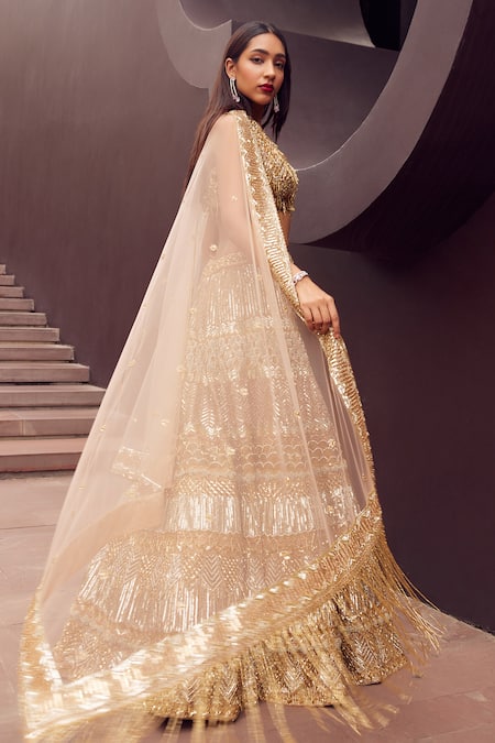 Shop_Istya_Gold Net Sequins, Cut Work Plunge Neck Metallic And Beads Embroidered Lehenga Set _at_Aza_Fashions
