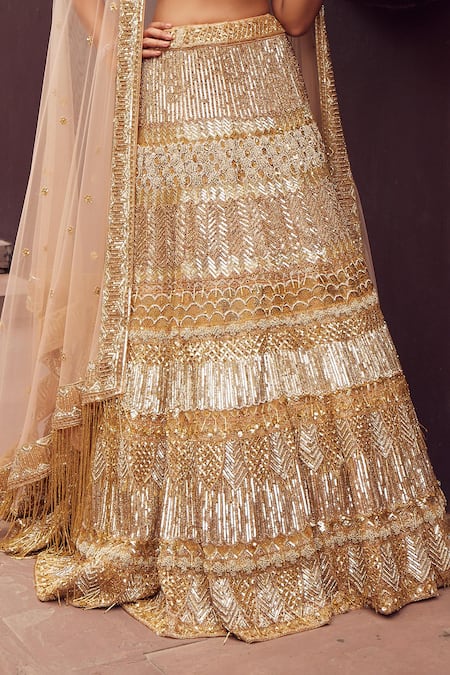 Buy_Istya_Gold Net Sequins, Cut Work Plunge Neck Metallic And Beads Embroidered Lehenga Set _Online_at_Aza_Fashions