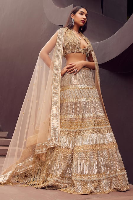 Shop_Istya_Gold Net Sequins, Cut Work Plunge Neck Metallic And Beads Embroidered Lehenga Set _Online_at_Aza_Fashions