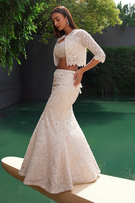 Shop Istya Ivory Net Sequins, Cut Work Collared Embroidered Fish Lehenga Cape Set at Aza Fashions Shop_Istya_Ivory Net Sequins, Cut Work Collared Embroidered Fish Lehenga Cape Set _at_Aza_Fashions