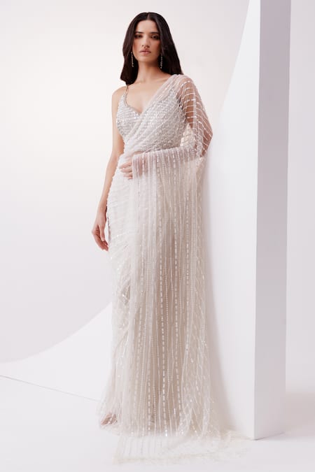 Shop Istya Ivory Net Sequins, Stones And Embellished Saree With Blouse at Aza Fashions Shop_Istya_Ivory Net Sequins, Stones And Embellished Saree With Blouse _at_Aza_Fashions