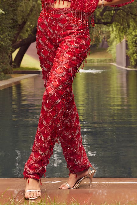 Istya Red Net Sequins, Cut Work, Stones Tassel Embroidered Pant Set With Crop Jacket Online at Aza Fashions Istya_Red Net Sequins, Cut Work, Stones Tassel Embroidered Pant Set With Crop Jacket _Online_at_Aza_Fashions