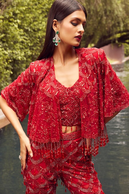 Shop Istya Red Net Sequins, Cut Work, Stones Tassel Embroidered Pant Set With Crop Jacket Online at Aza Fashions Shop_Istya_Red Net Sequins, Cut Work, Stones Tassel Embroidered Pant Set With Crop Jacket _Online_at_Aza_Fashions